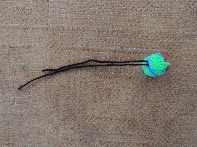 It should now look like this - the long ends are useful for sewing on your pom pom.