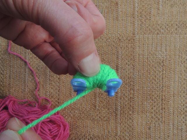 Try and wind on a similar amount of wool or you will end up with an uneven pom pom.